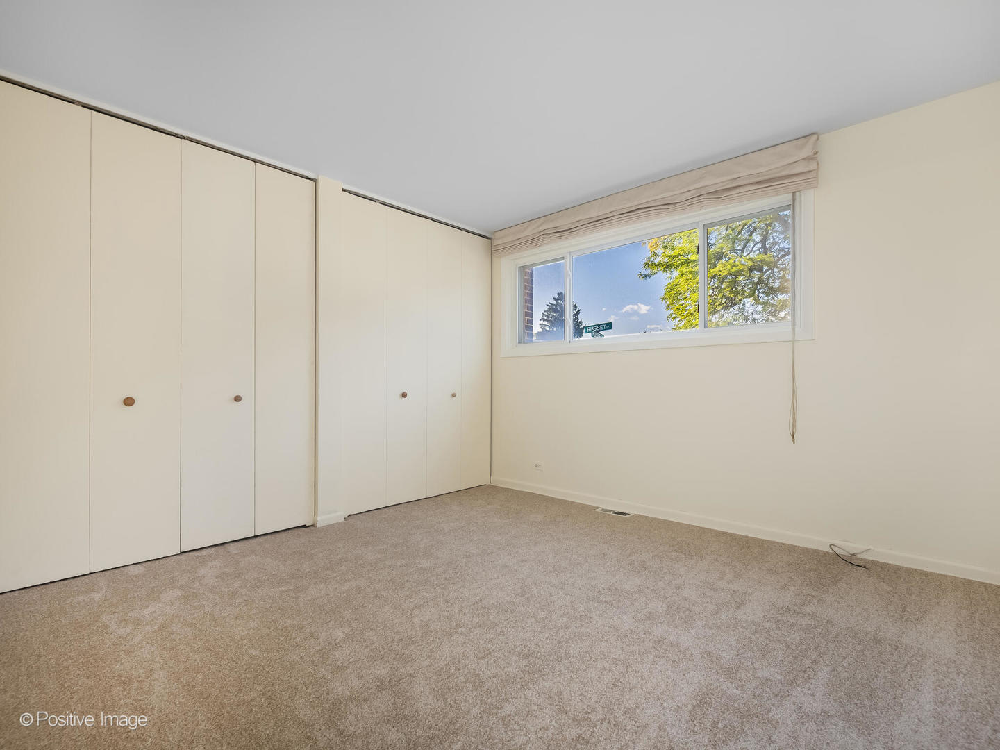 4710 Russett Lane, Unit R1 Skokie, IL 60076 - Photo 12 of 16 a view of an empty room with a window