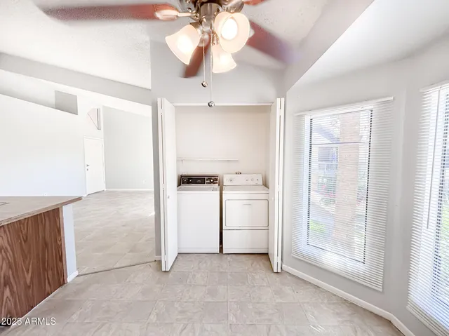 a kitchen with granite countertop a sink stove and cabinets