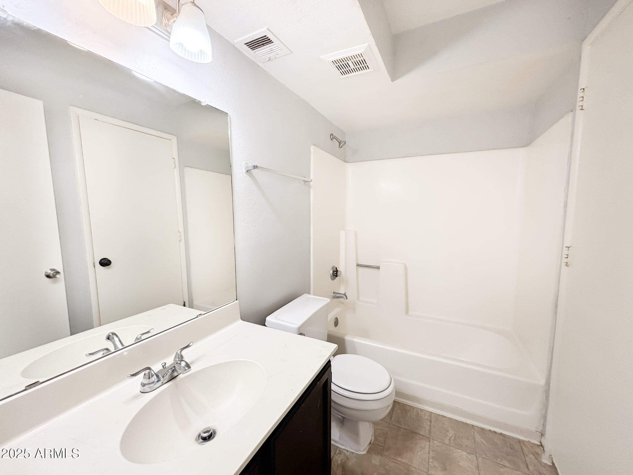 5236 West Peoria Avenue, Unit 212 Glendale, AZ 85302 - Photo 14 of 22 a bathroom with a sink a toilet and shower