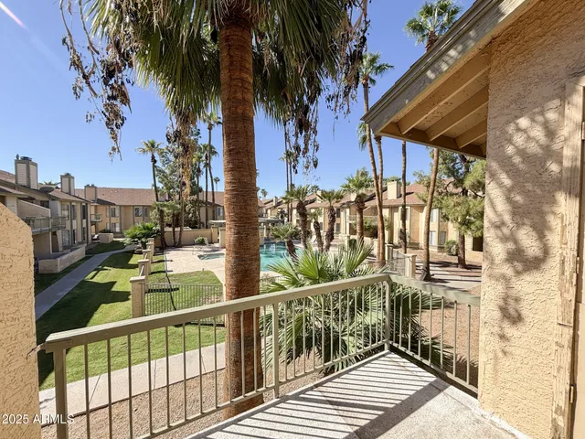 a view of balcony and wooden floor