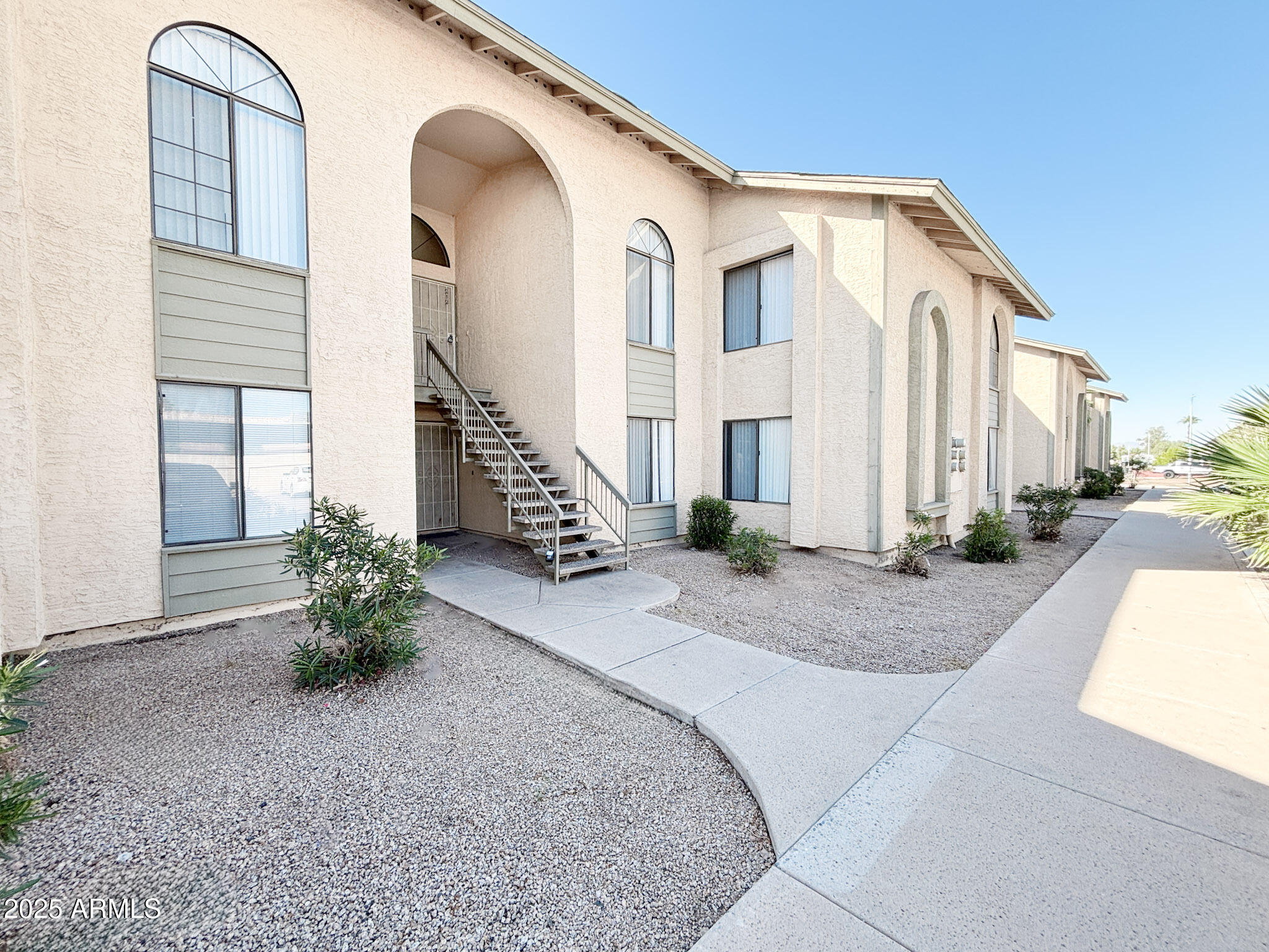 5236 West Peoria Avenue, Unit 212 Glendale, AZ 85302 - Photo 2 of 22 a view of a house with a backyard