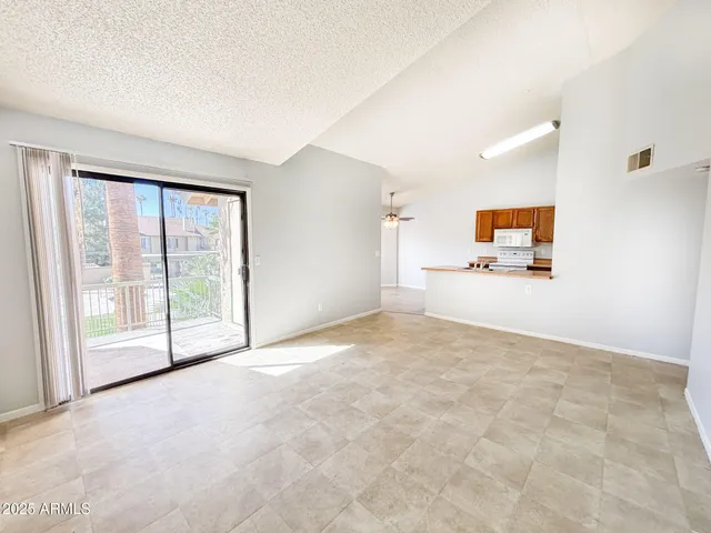 a view of staircase with white walls and windows