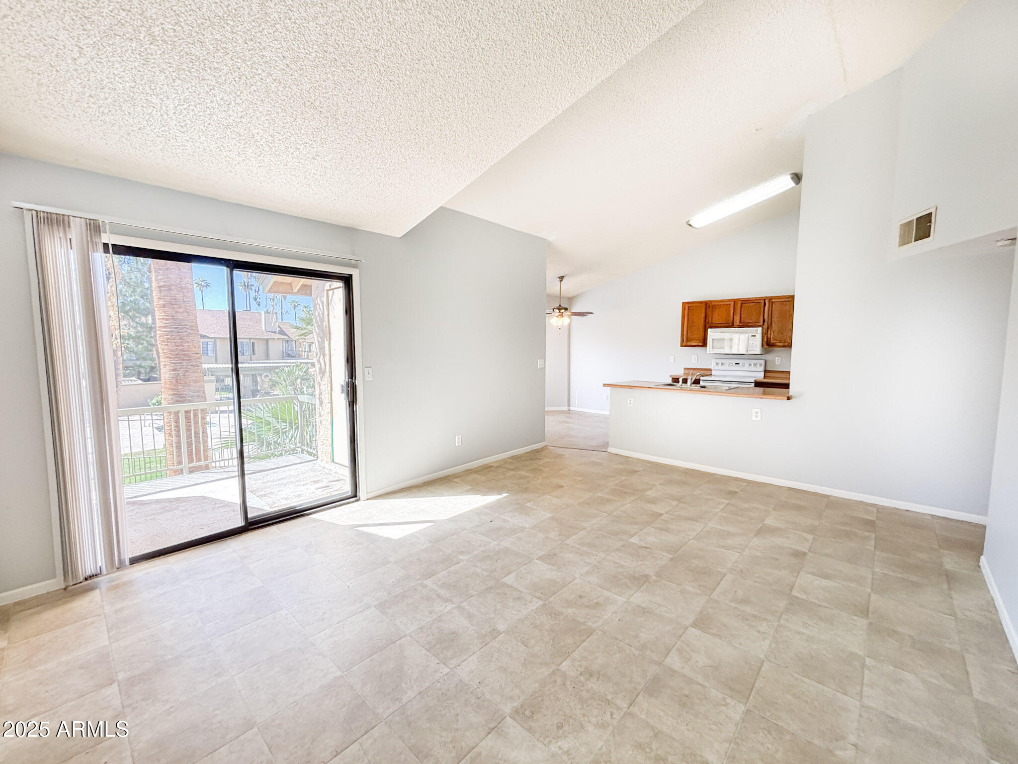 5236 West Peoria Avenue, Unit 212 Glendale, AZ 85302 - Photo 5 of 22 a view of an empty room with a window