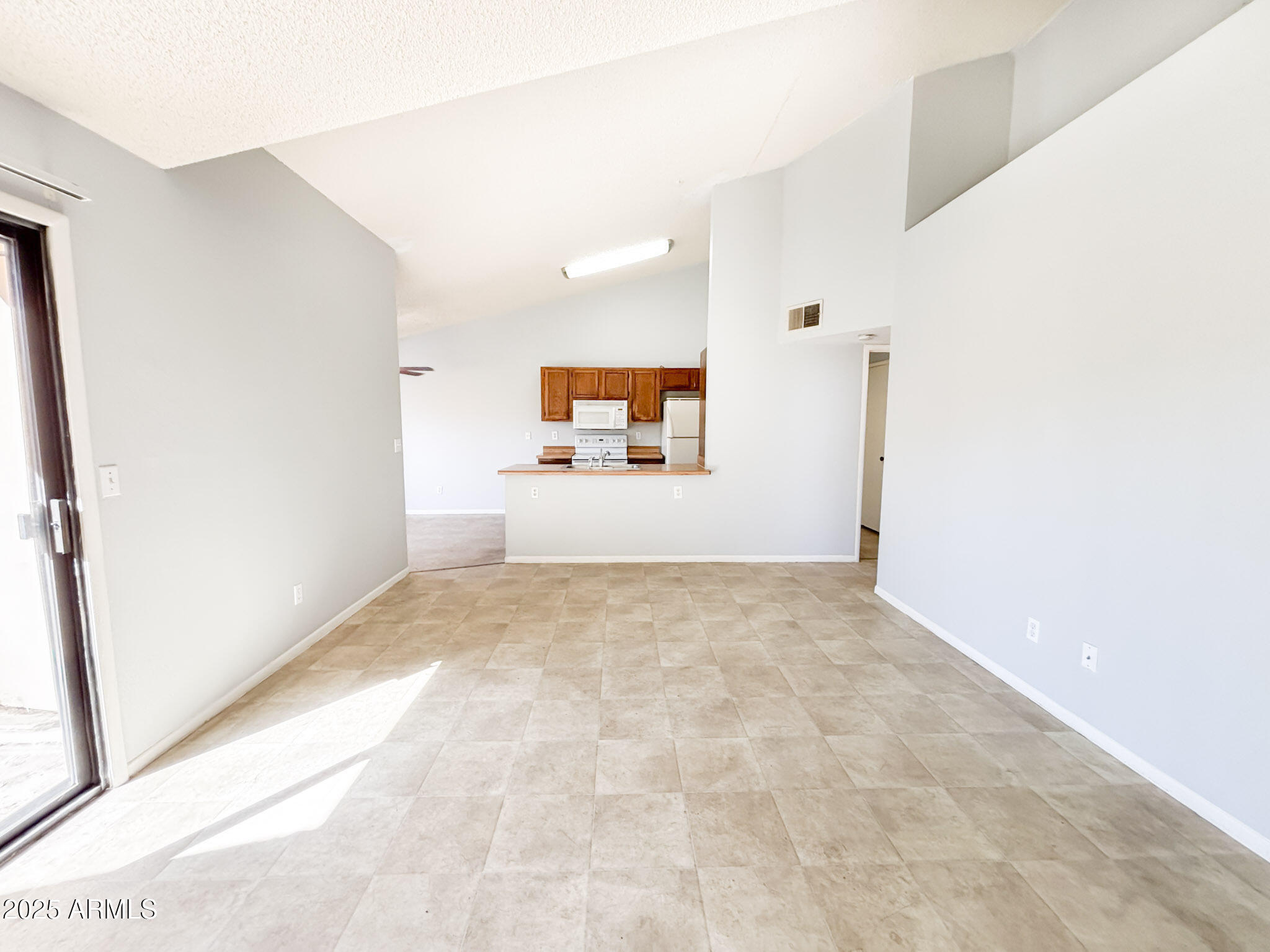 5236 West Peoria Avenue, Unit 212 Glendale, AZ 85302 - Photo 6 of 22 a view of a big room with closet and windows