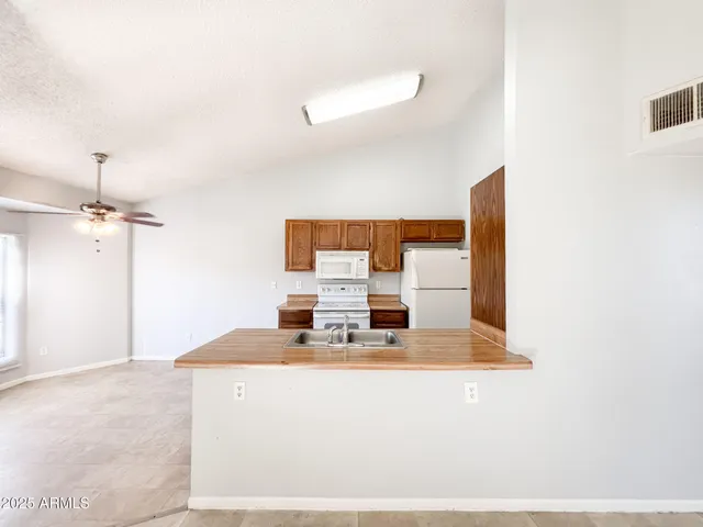 a view of a big room with closet and windows