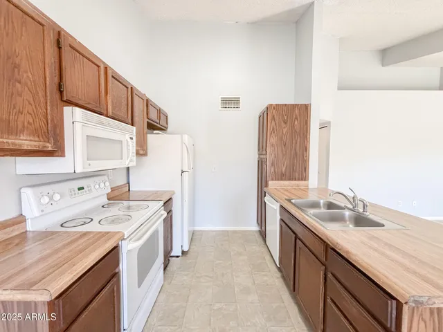a bathroom with a sink vanity and mirror