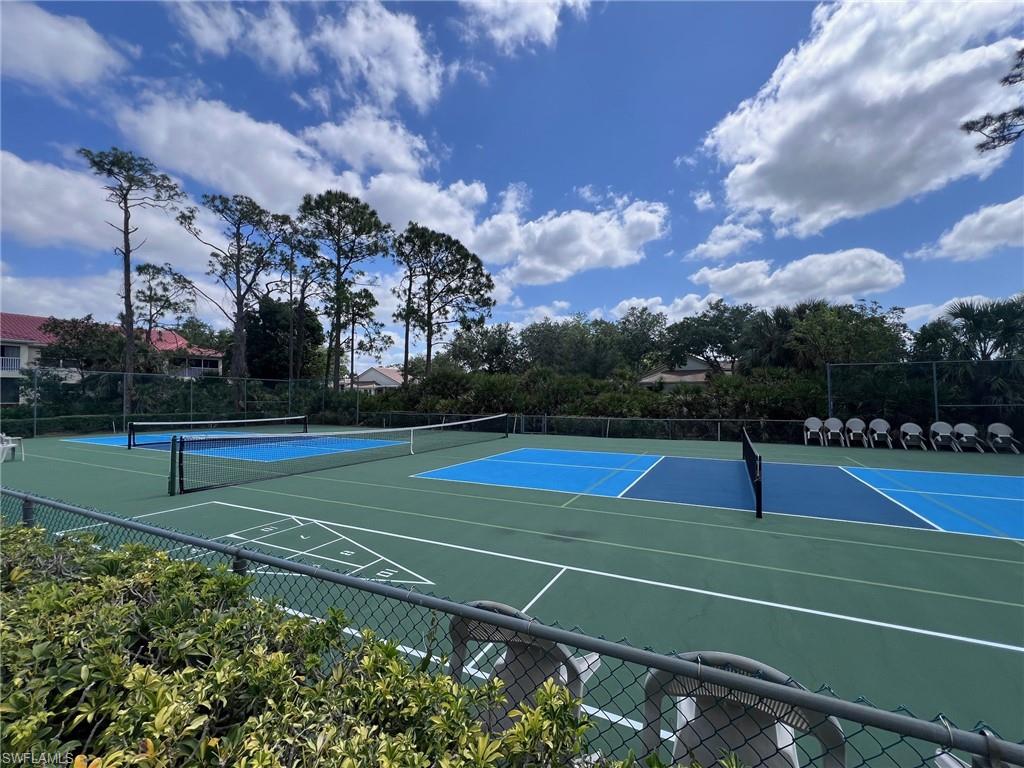 1051 Eastham Way, Unit B104 Naples, FL 34104 - Photo 19 of 23 a view of a tennis court