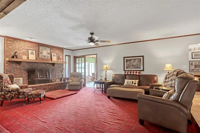 a living room with furniture a dining table and chairs with wooden floor