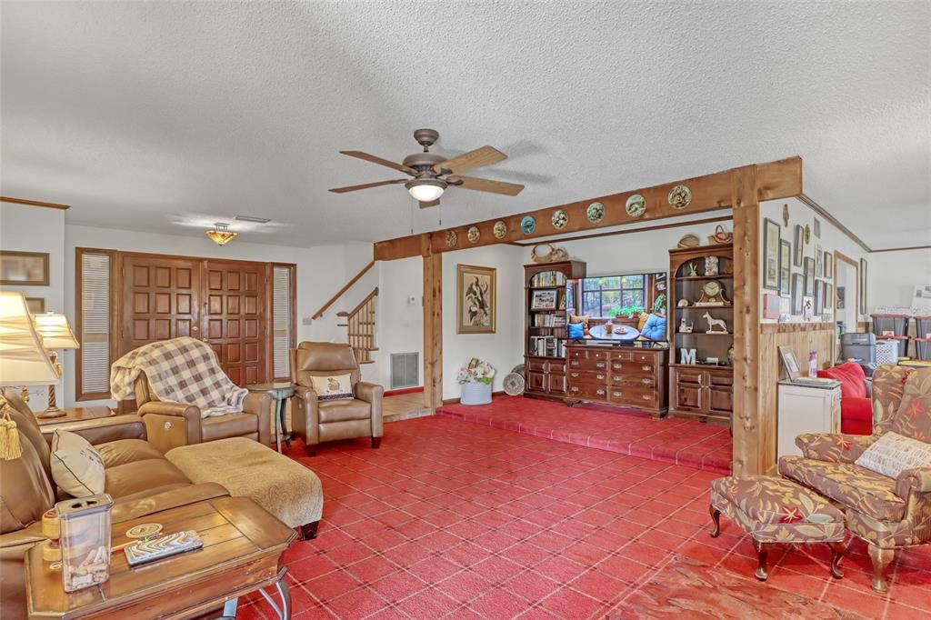 5005 Highway 1 Mims, FL 32754 - Photo 13 of 69 a bedroom with furniture and a large window