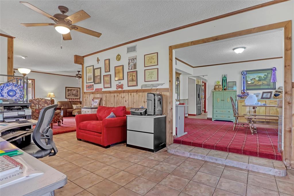 5005 Highway 1 Mims, FL 32754 - Photo 15 of 69 a living room with furniture gym equipment and view of kitchen