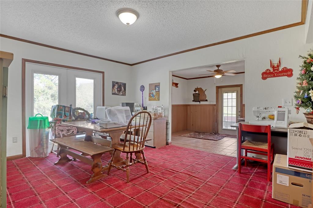 5005 Highway 1 Mims, FL 32754 - Photo 17 of 69 a living room with furniture a dining table and chairs with wooden floor
