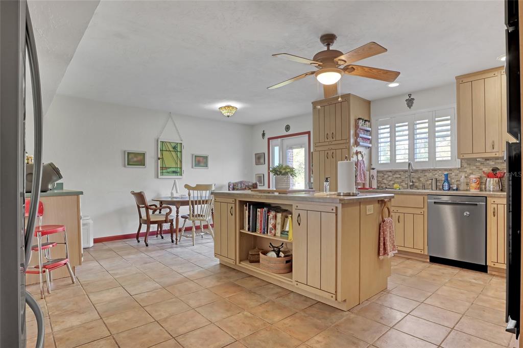 5005 Highway 1 Mims, FL 32754 - Photo 18 of 69 a kitchen with cabinets and chairs