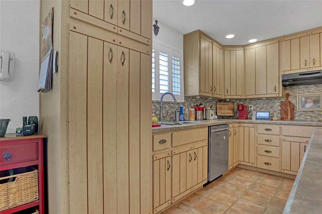 5005 Highway 1 Mims, FL 32754 - Photo 21 of 69 a kitchen with granite countertop white cabinets sink and stainless steel appliances