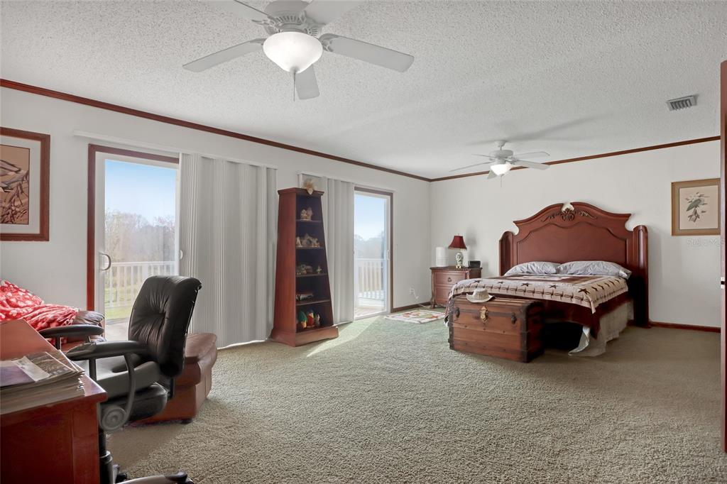 5005 Highway 1 Mims, FL 32754 - Photo 29 of 69 a living room with furniture a ceiling fan and a window
