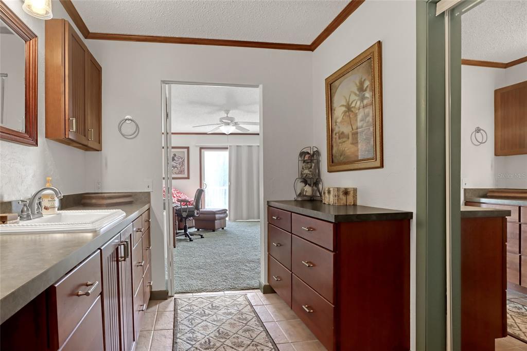 5005 Highway 1 Mims, FL 32754 - Photo 33 of 69 a spacious bathroom with a granite countertop sink a mirror and a