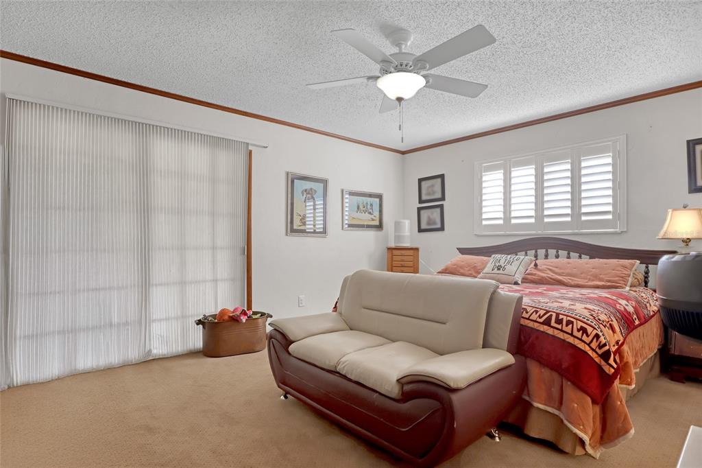 5005 Highway 1 Mims, FL 32754 - Photo 35 of 69 a spacious bedroom with a bed couch and window