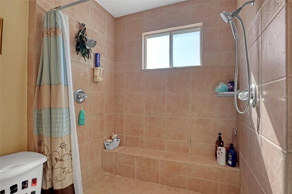 5005 Highway 1 Mims, FL 32754 - Photo 38 of 69 a bathroom with a shower and a toilet