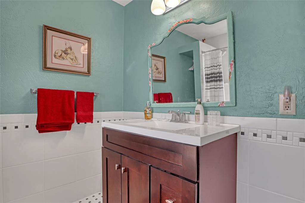 5005 Highway 1 Mims, FL 32754 - Photo 43 of 69 a bathroom with a sink vanity and a mirror