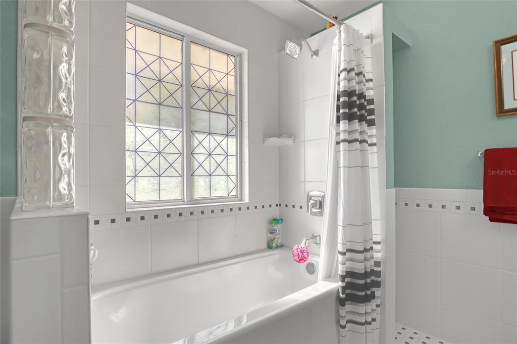 5005 Highway 1 Mims, FL 32754 - Photo 44 of 69 a bathroom with a bathtub and shower