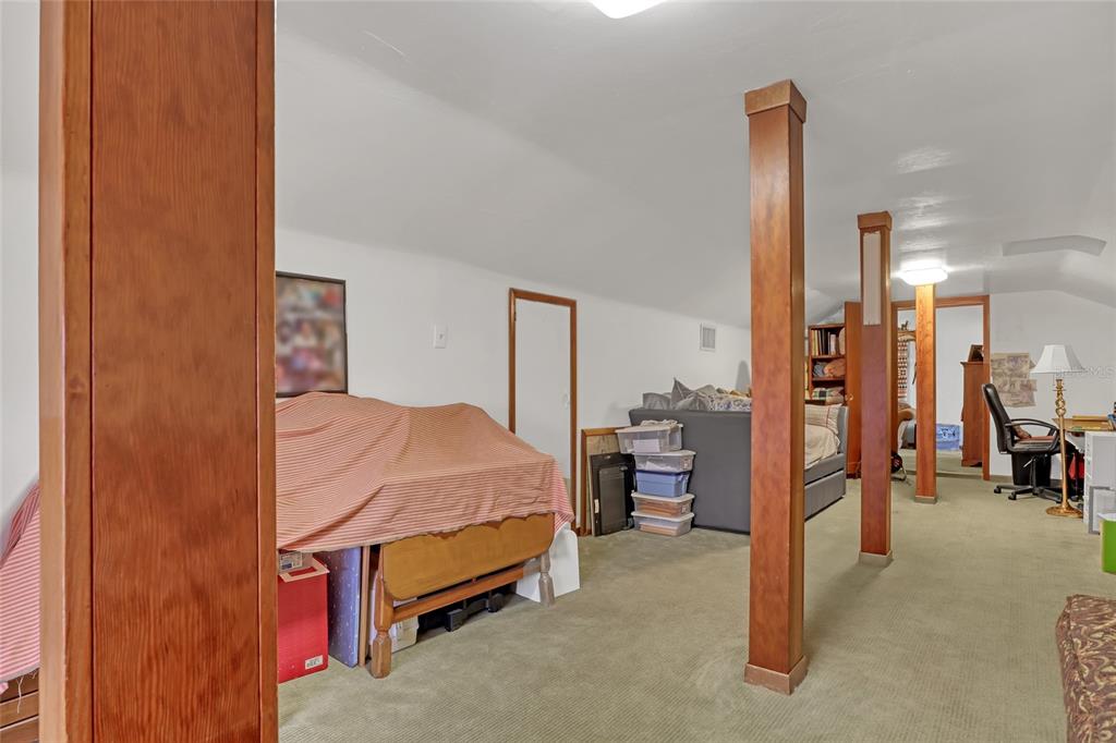 5005 Highway 1 Mims, FL 32754 - Photo 46 of 69 a bedroom with a bed and a view of en suite bathroom