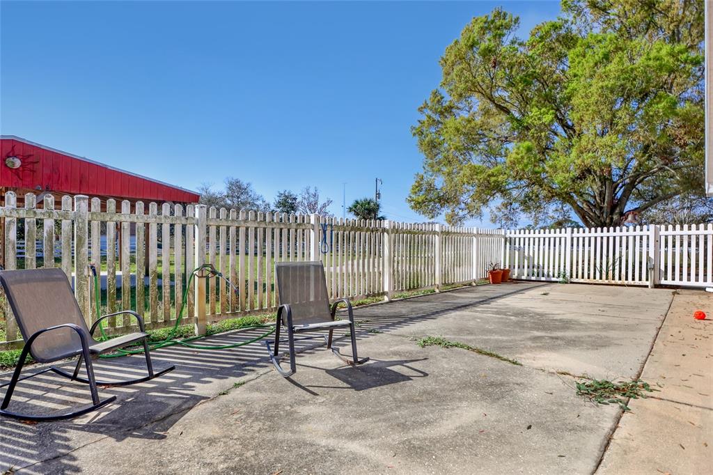 5005 Highway 1 Mims, FL 32754 - Photo 53 of 69 a view of a chair and table in the back yard of the house