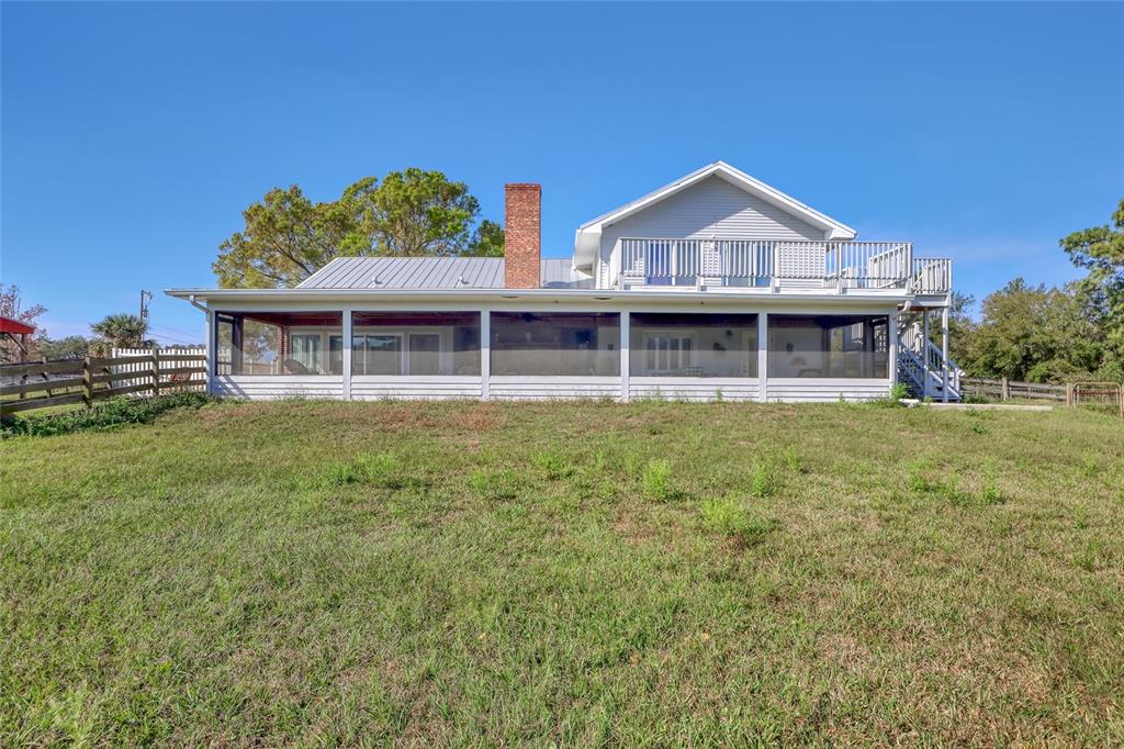 5005 Highway 1 Mims, FL 32754 - Photo 58 of 69 a view of a house with a yard and potted plants