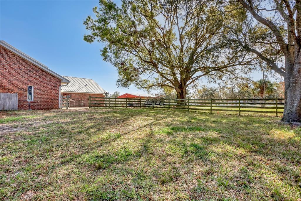 5005 Highway 1 Mims, FL 32754 - Photo 64 of 69 a view of outdoor space with deck and large trees