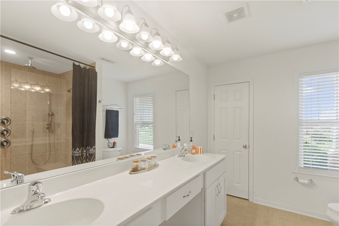 2900 Highway 187 Anderson, SC 29626 - Photo 31 of 41 Dual vanities and an illuminated mirror complete this refreshing bathroom space.