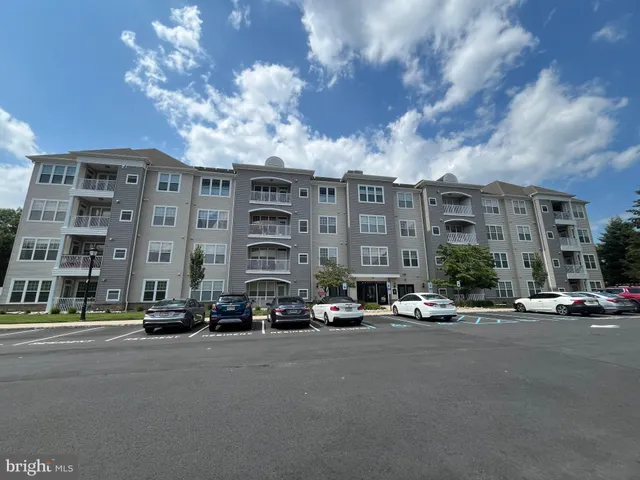 a city street lined with buildings and cars