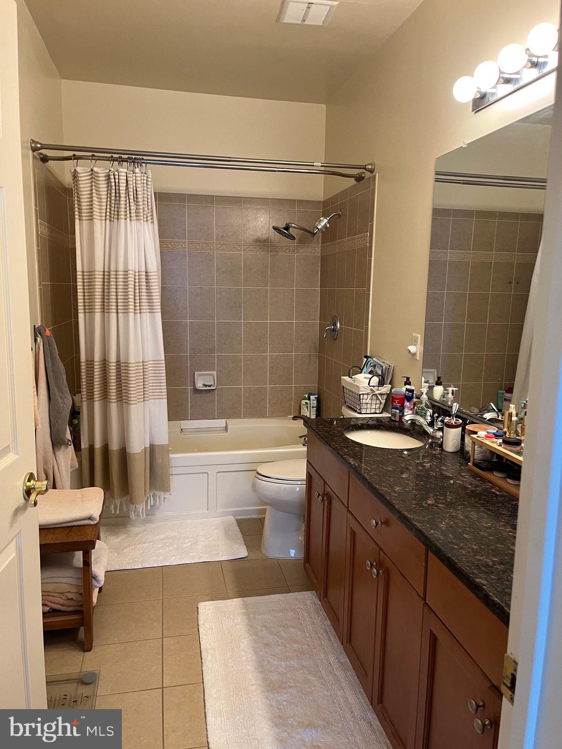 435 Masterson Court Ewing, NJ 08618 - Photo 11 of 14 a bathroom with a granite countertop sink a toilet a mirror and bathtub