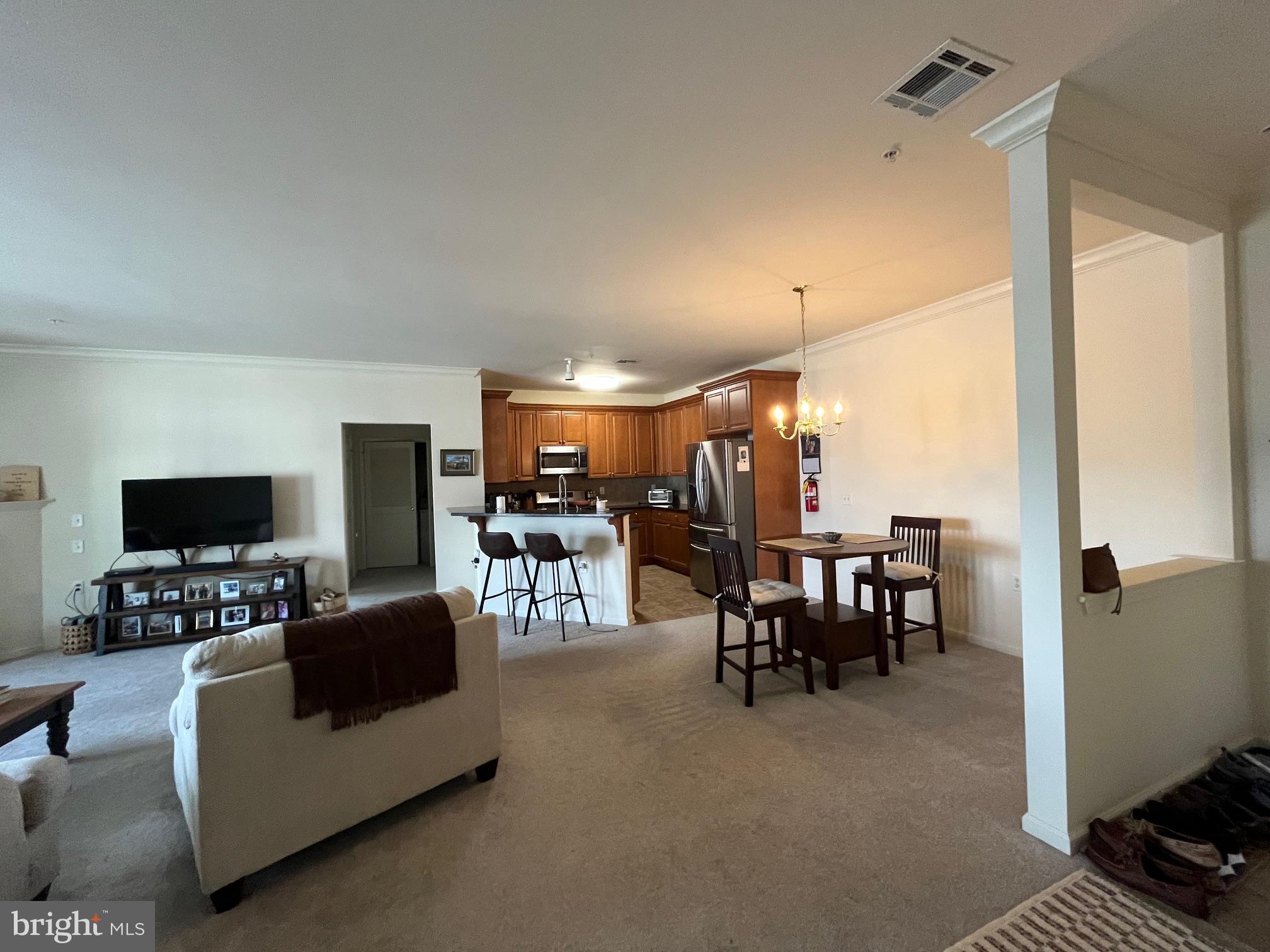 435 Masterson Court Ewing, NJ 08618 - Photo 3 of 14 a living room with furniture and a flat screen tv