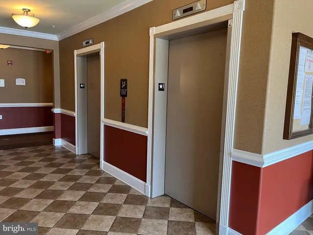 a view of a bathroom with a door and a sink