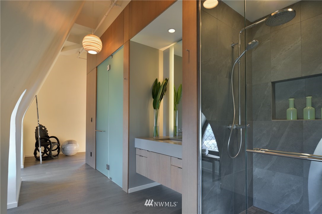 506 2nd Avenue, Unit PH Seattle, WA 98104 - Photo 24 of 37 a view of a hallway with a bathroom