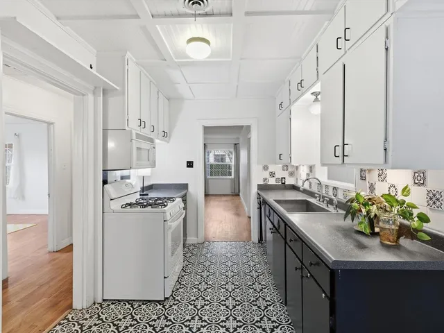 a kitchen with cabinets and stainless steel appliances