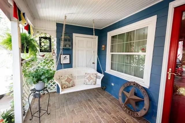 a bed sitting in a room next to a window