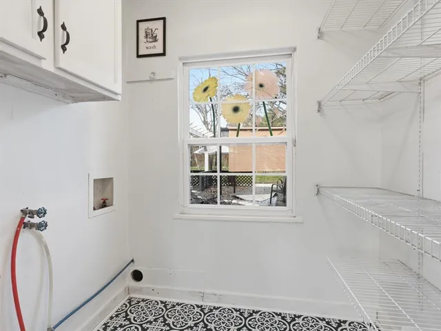 a bathroom with a window and a shower