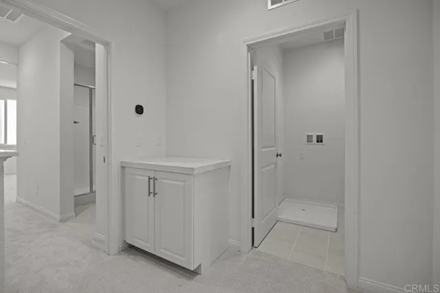 a bathroom with a sink toilet vanity and tub