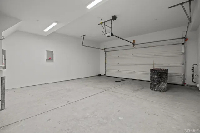 a view of a building with a large window and sitting area