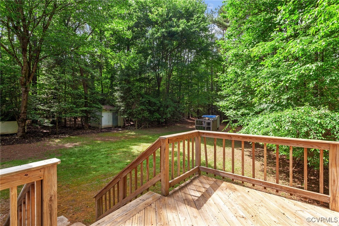 3138 Pineview Drive Powhatan, VA 23139 - Photo 12 of 46 a view of a wooden deck next to a yard
