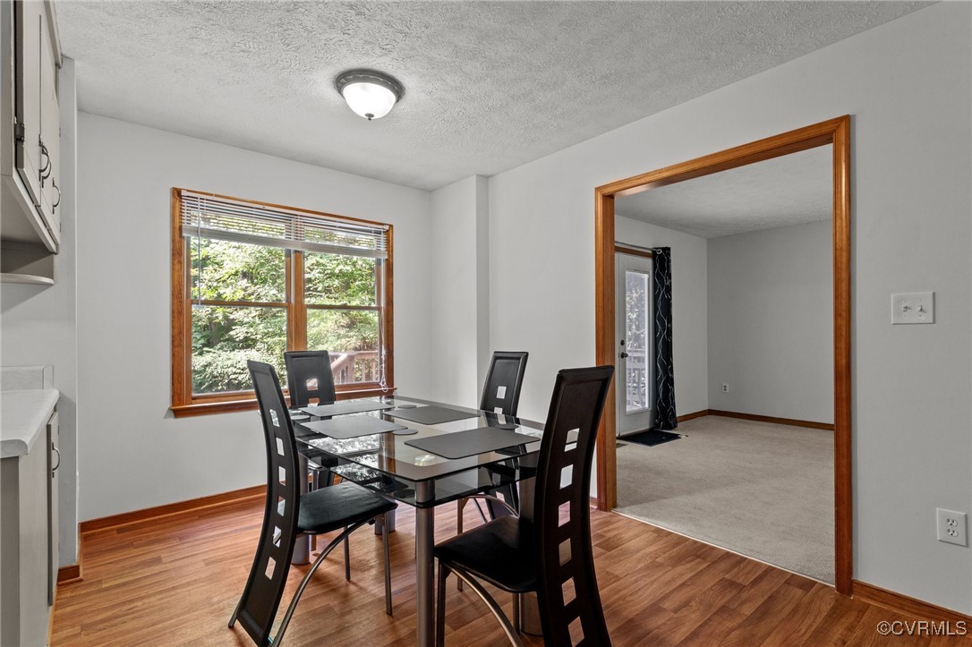 3138 Pineview Drive Powhatan, VA 23139 - Photo 20 of 46 a view of a dining room with furniture and wooden floor