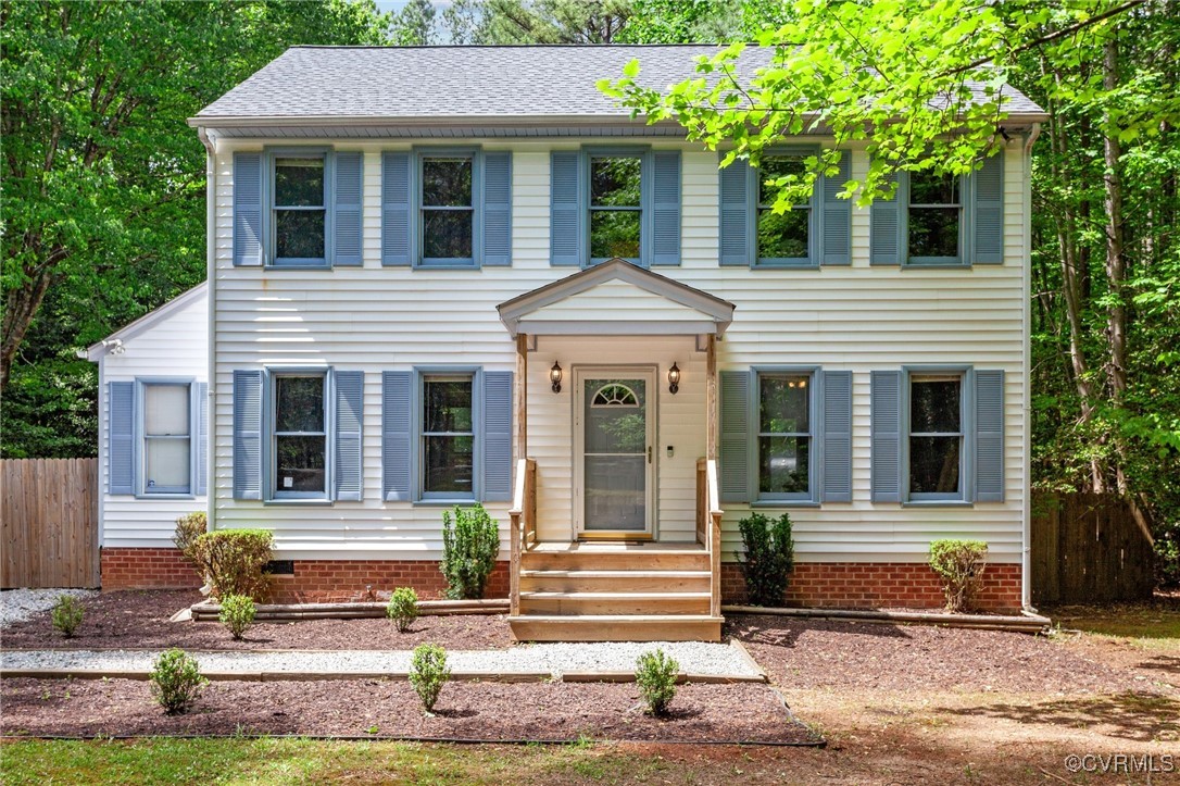 3138 Pineview Drive Powhatan, VA 23139 - Photo 2 of 46 a front view of a house with a yard