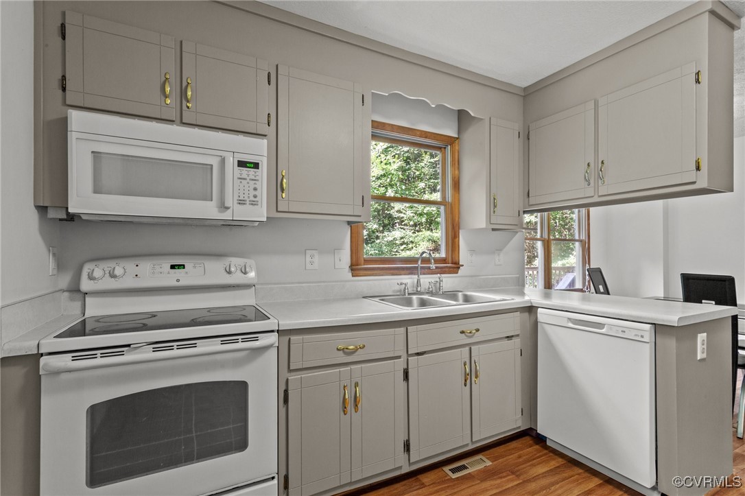 3138 Pineview Drive Powhatan, VA 23139 - Photo 27 of 46 a kitchen with cabinets appliances a sink and a window