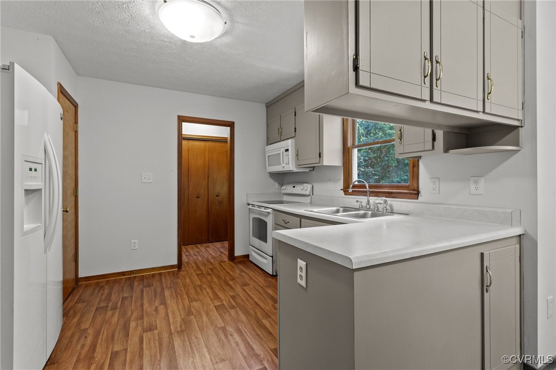 3138 Pineview Drive Powhatan, VA 23139 - Photo 30 of 46 a kitchen with a sink cabinets stainless steel appliances and a window