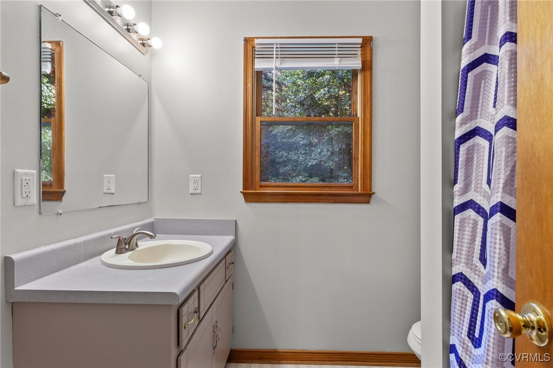3138 Pineview Drive Powhatan, VA 23139 - Photo 38 of 46 a bathroom with a sink vanity and a mirror