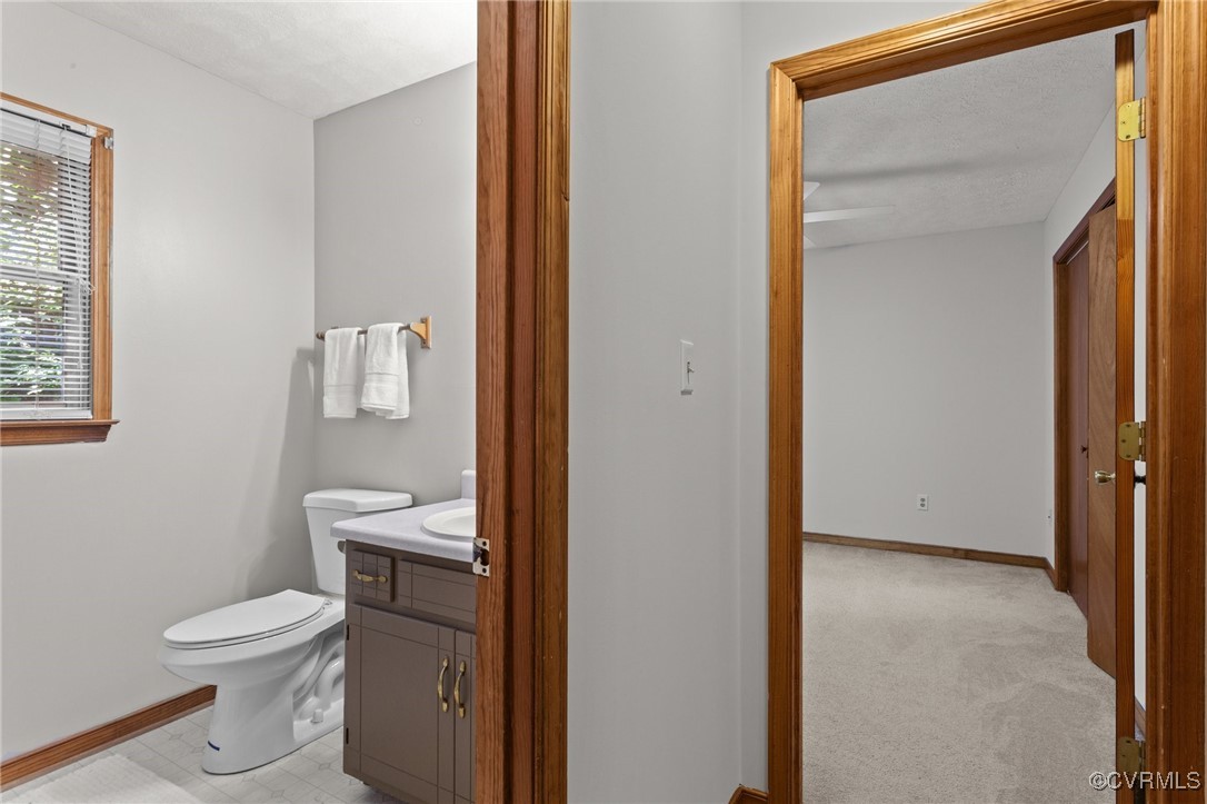 3138 Pineview Drive Powhatan, VA 23139 - Photo 42 of 46 a white toilet sitting next to a bathroom sink
