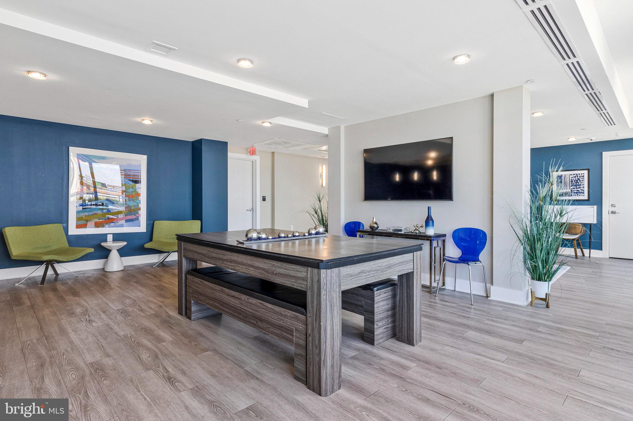 88 V Street Southwest, Unit 505 Washington, DC 20024 - Photo 12 of 38 a living room with furniture and a flat screen tv