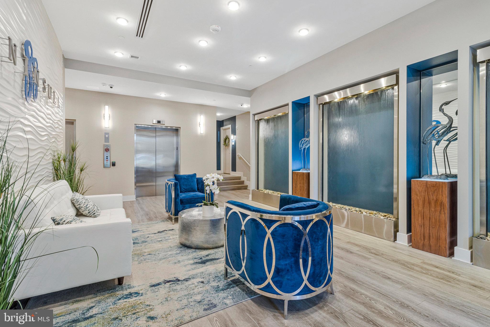 88 V Street Southwest, Unit 505 Washington, DC 20024 - Photo 20 of 38 a living room with furniture a large window and wooden floor