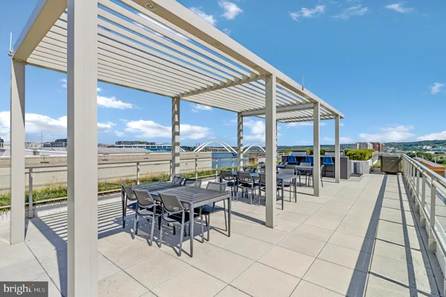 a view of a terrace with furniture and stove