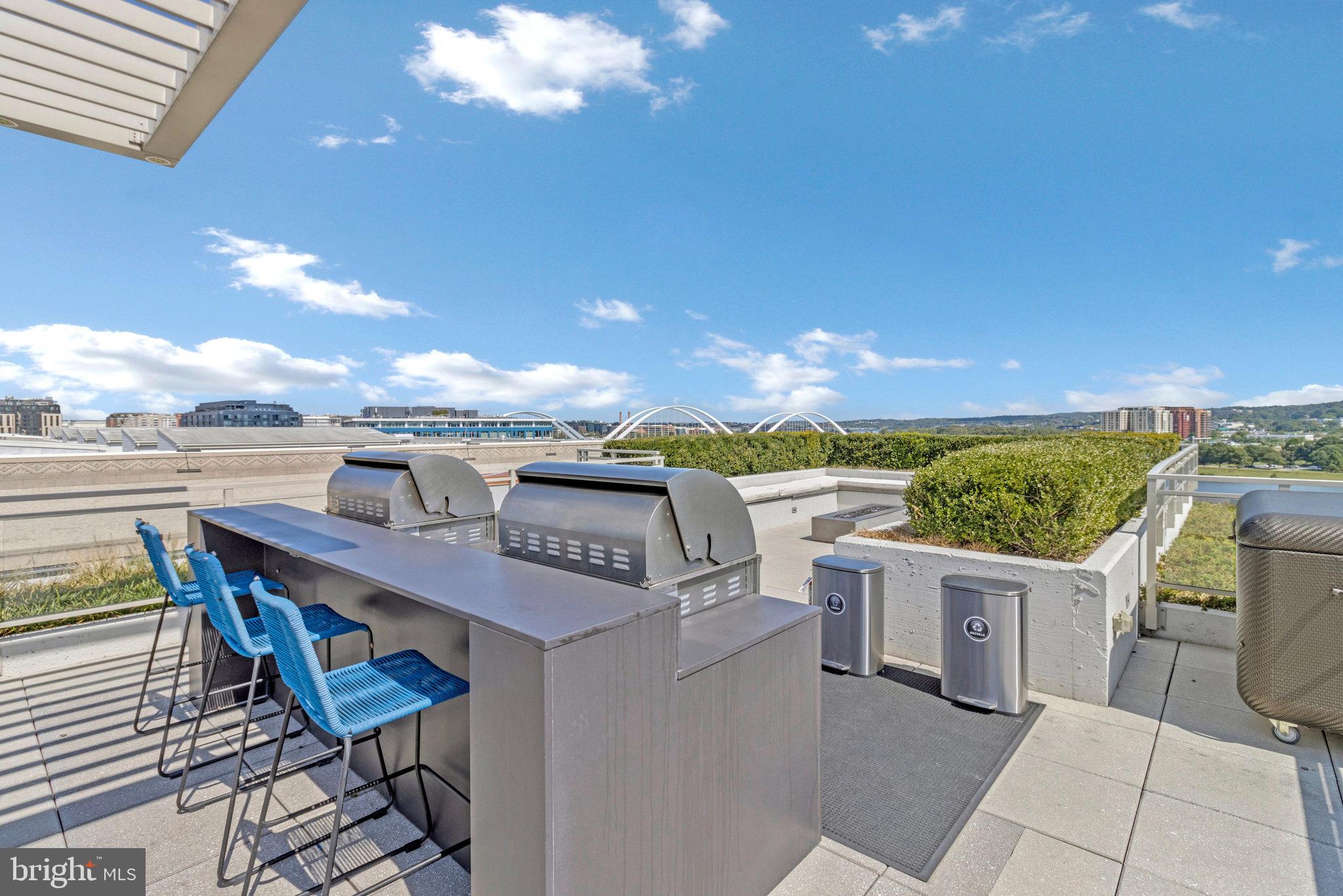 88 V Street Southwest, Unit 505 Washington, DC 20024 - Photo 33 of 38 a view of a terrace with furniture and stove