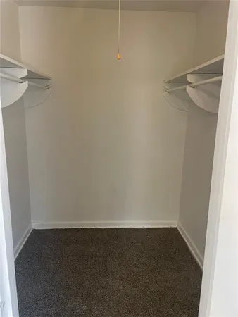 a bathroom with a toilet sink and window